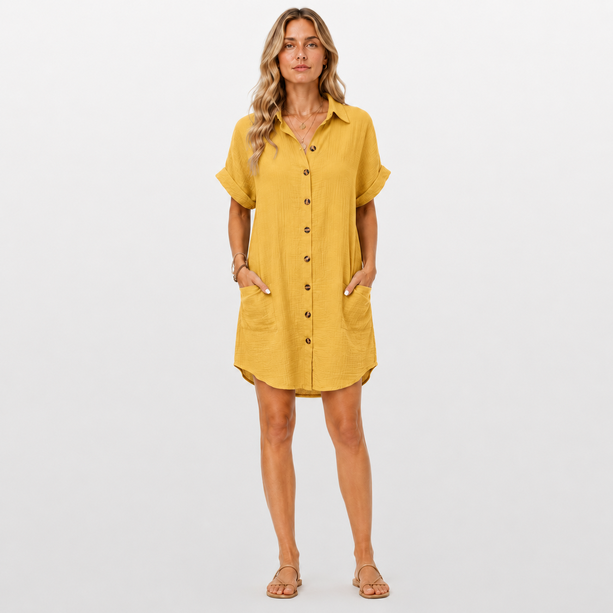 Woman wearing a yellow dress on a plain background