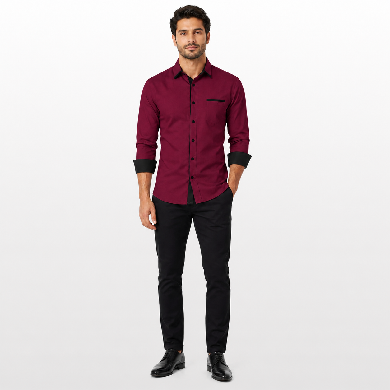 Man wearing a maroon shirt and black pants on a white background
