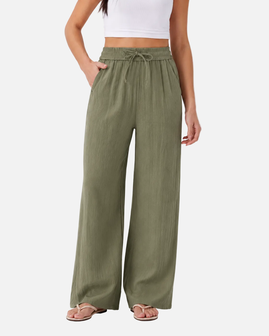 Person wearing olive green wide-leg pants on a white background
