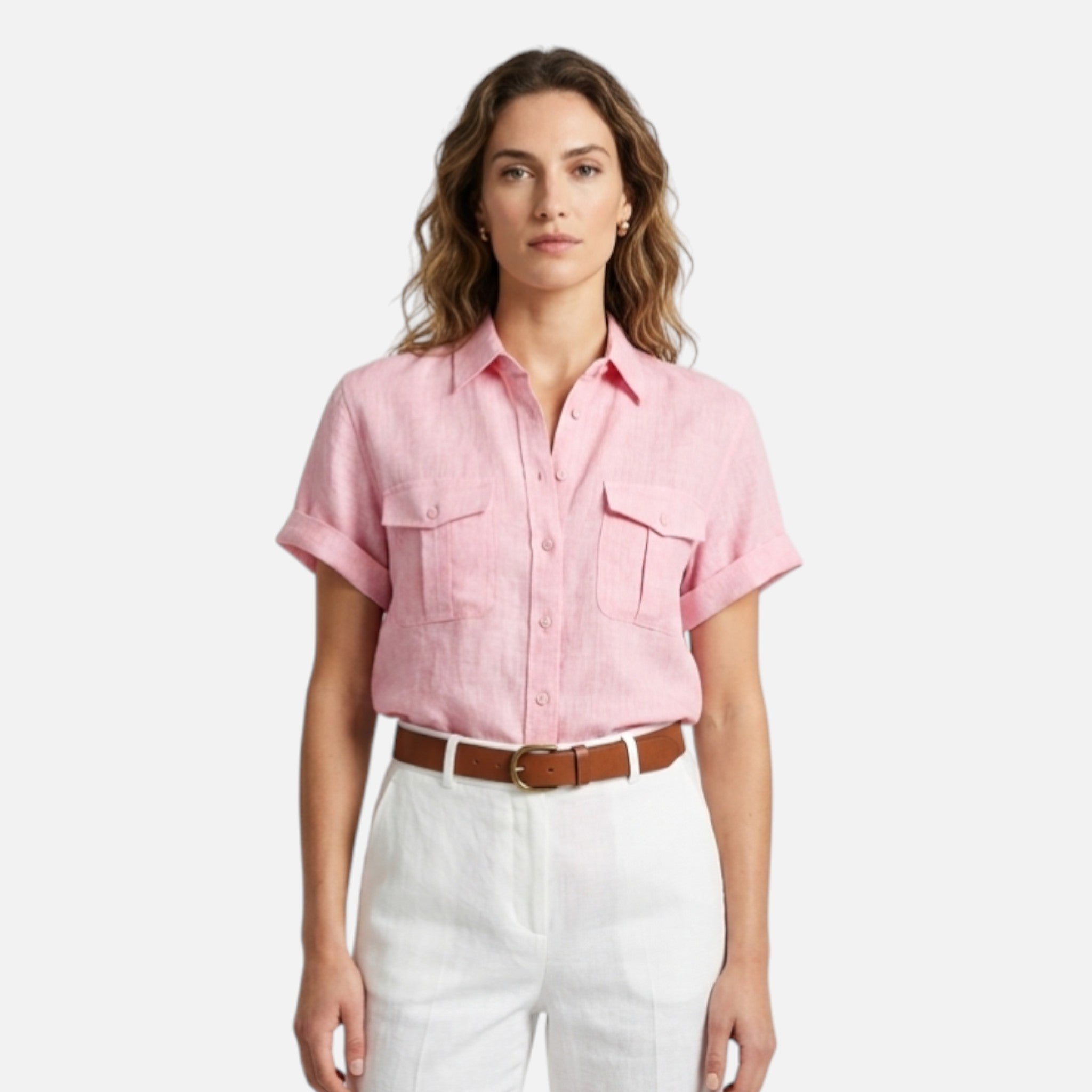 Woman wearing a pink short-sleeve shirt and white pants on a white background