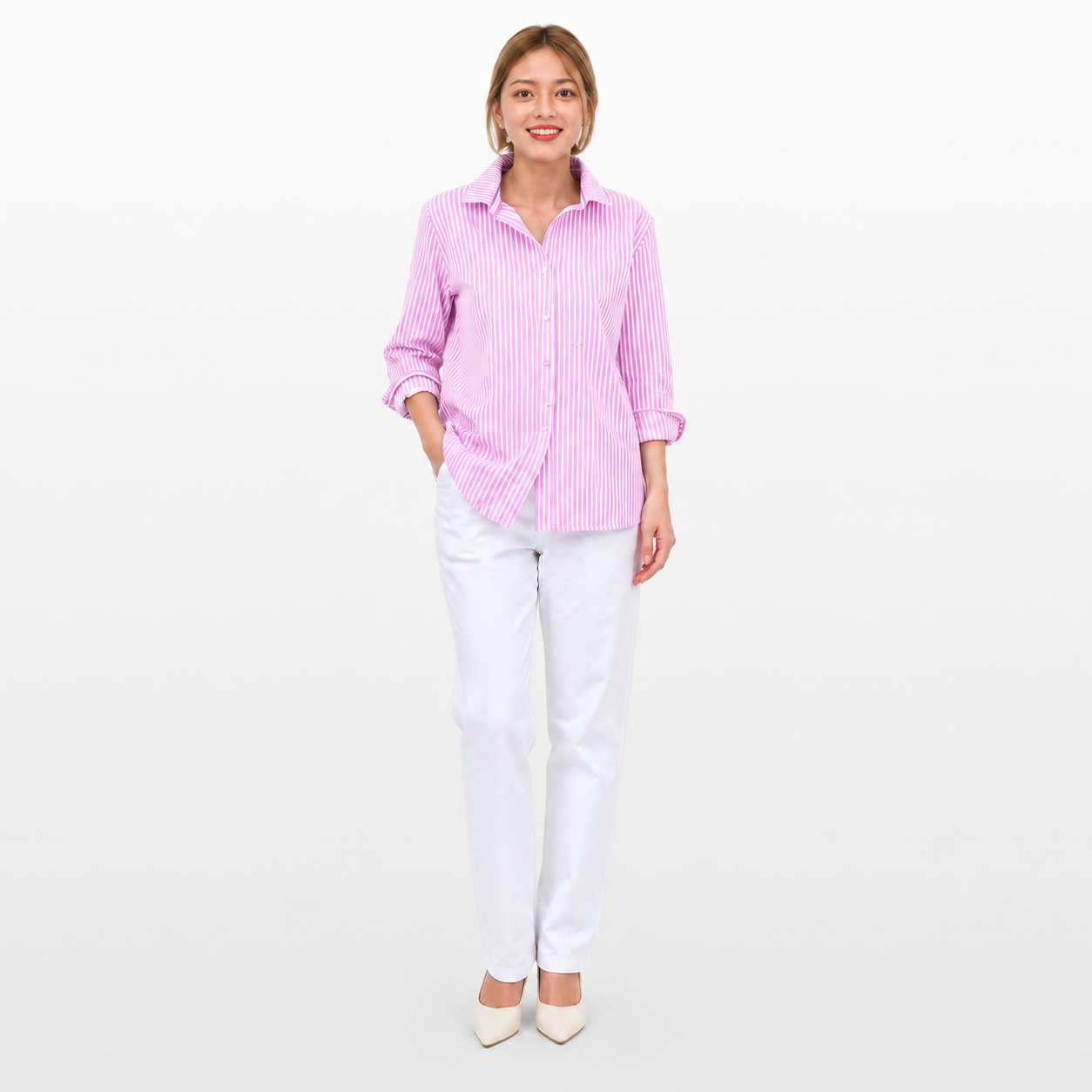 Woman wearing a pink striped shirt and white pants on a light gray background