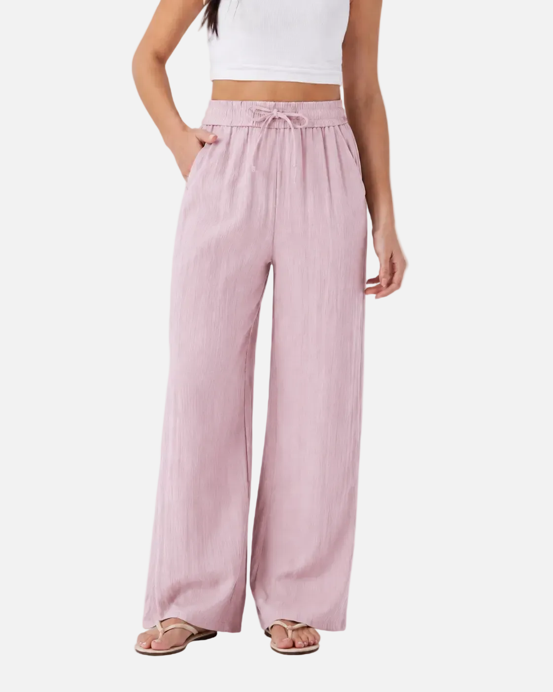 Pink wide-leg pants worn by a person on a white background