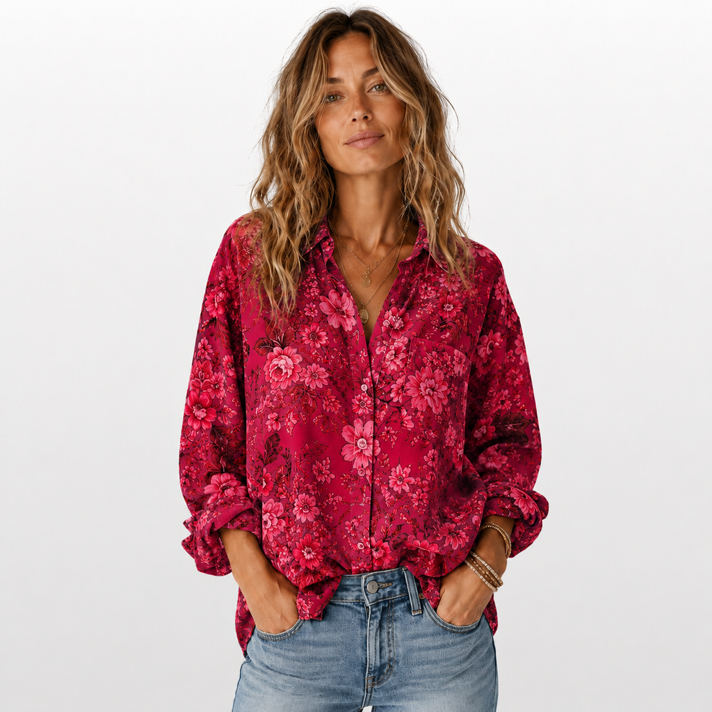 Woman wearing a red floral shirt and blue jeans on a white background