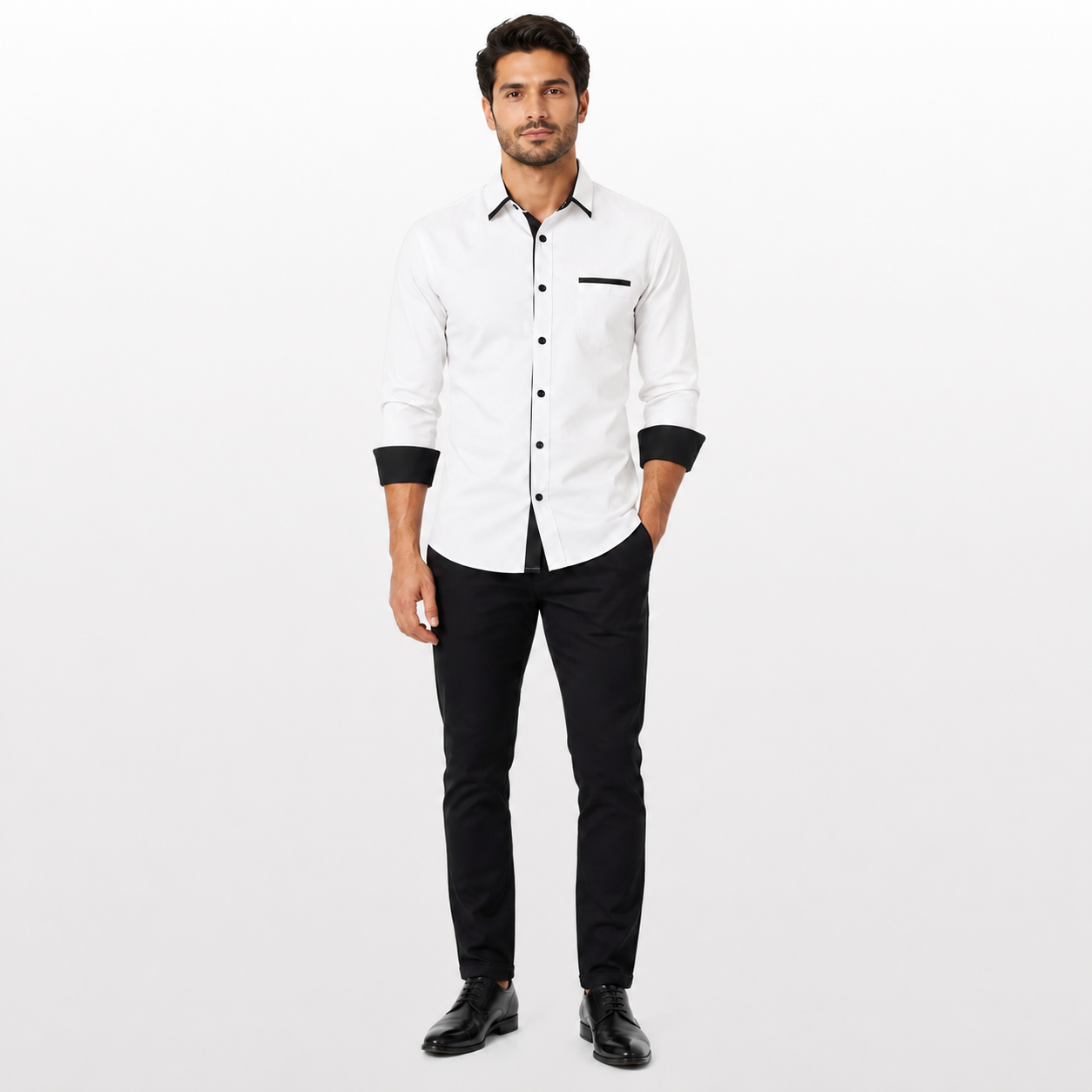 Man wearing a white shirt with black accents and black pants on a white background