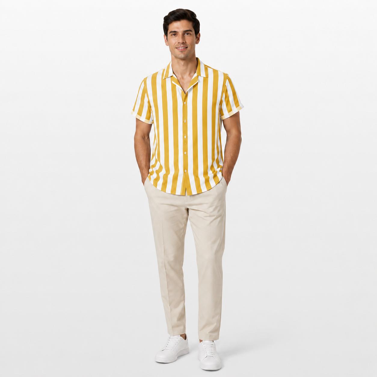 Man wearing a yellow and white striped shirt with beige pants on a white background